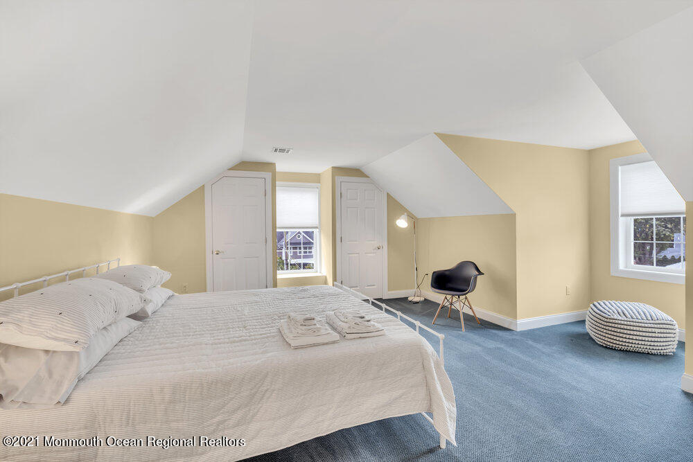 507 Washington Avenue Spring Lake, NJ 07762 - Photo 25 of 29 a bedroom with a bed and a couch