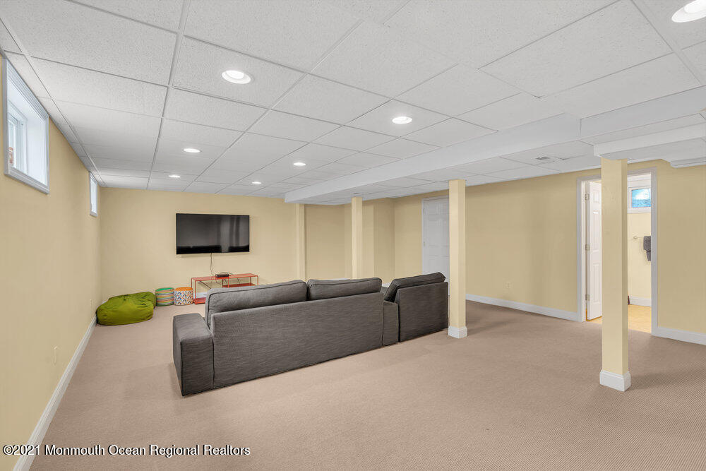 507 Washington Avenue Spring Lake, NJ 07762 - Photo 27 of 29 a living room with furniture and a flat screen tv