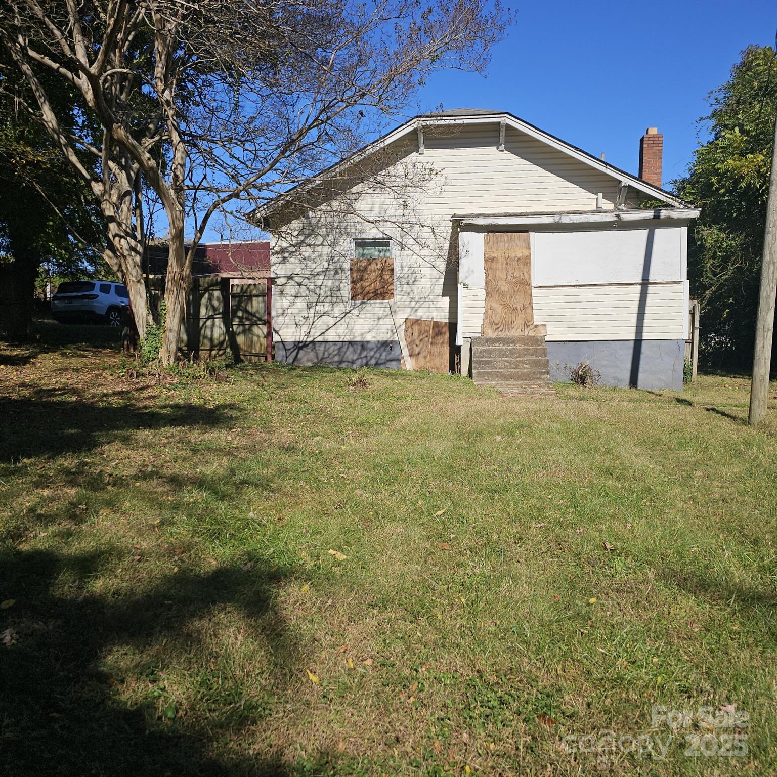 929 Key Street Charlotte, NC 28208 - Photo 2 of 3 a view of a house with a yard