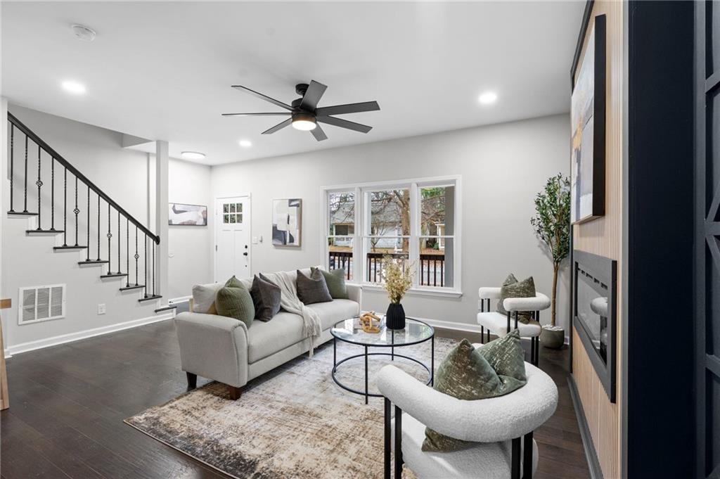 731 Dill Avenue Southwest Atlanta, GA 30310 - Photo 11 of 25 a living room with furniture and a chandelier
