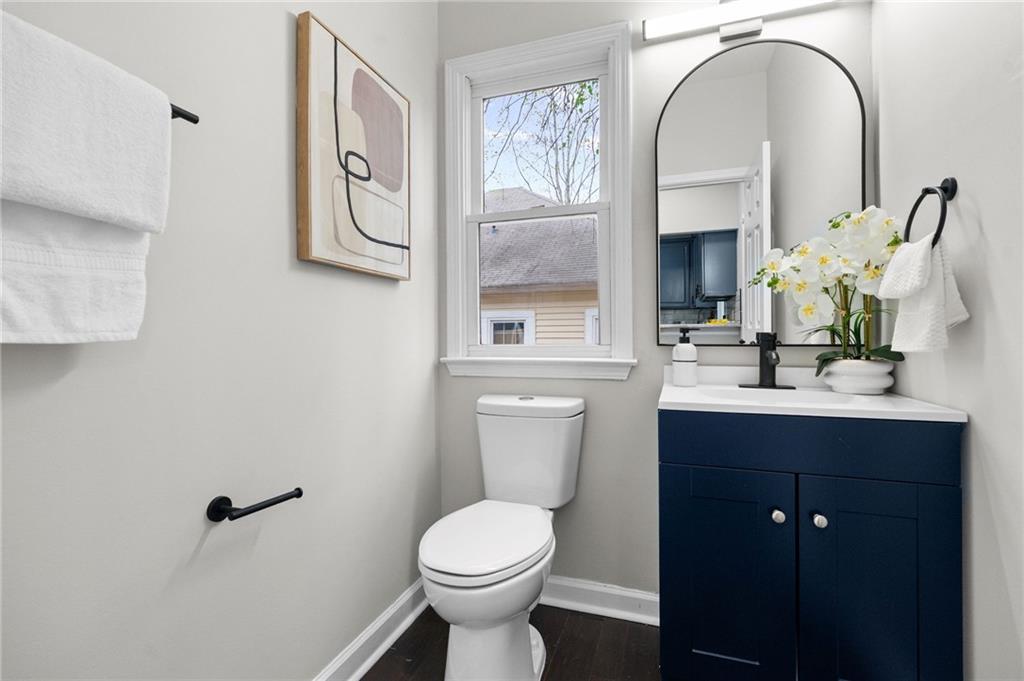 731 Dill Avenue Southwest Atlanta, GA 30310 - Photo 18 of 25 a bathroom with a sink a toilet and mirror