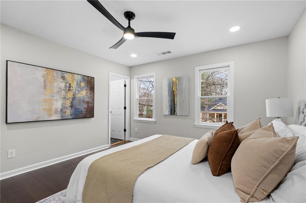 731 Dill Avenue Southwest Atlanta, GA 30310 - Photo 21 of 25 a bedroom with a large bed and a painting on the wall