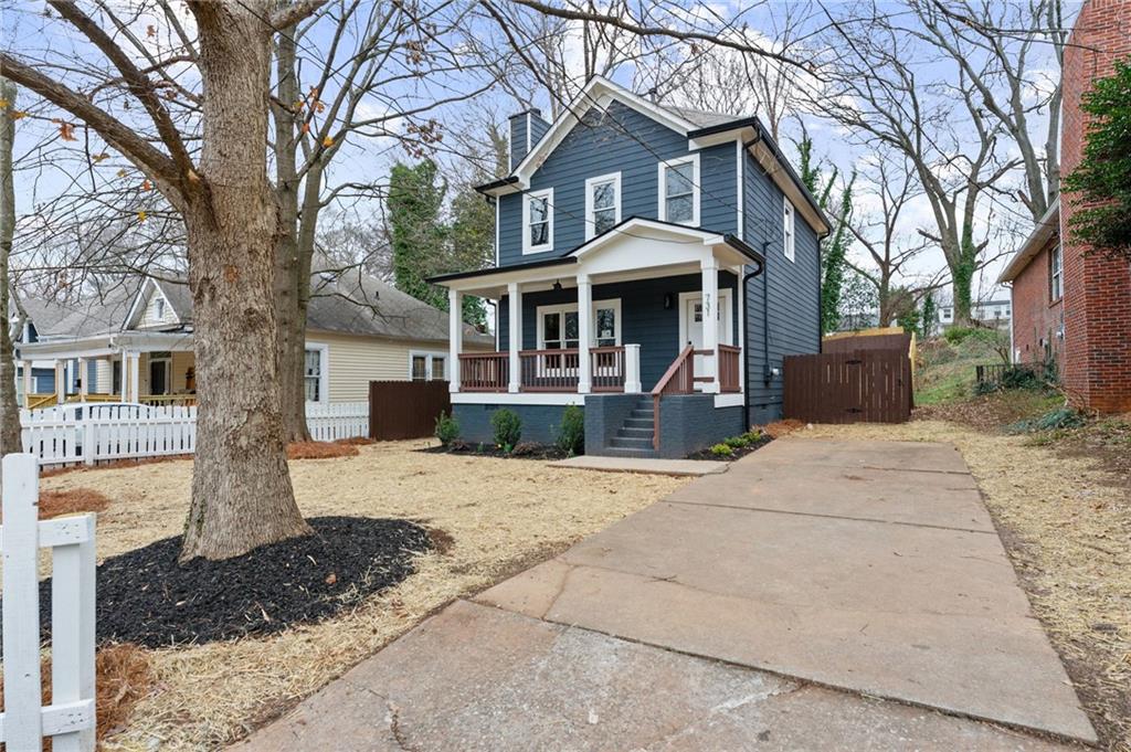 731 Dill Avenue Southwest Atlanta, GA 30310 - Photo 3 of 25 a front view of a house with a yard