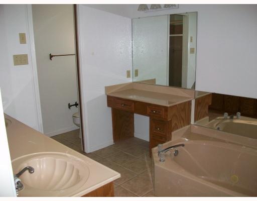 4702 Megal Drive Corpus Christi, TX 78413 - Photo 5 of 6 a bathroom with a tub sink and vanity