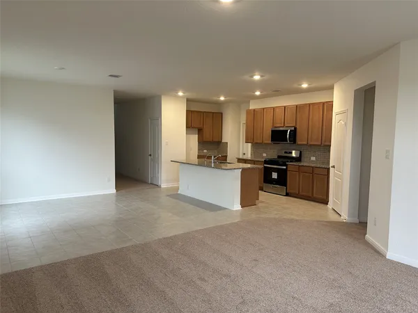 a view of a kitchen with a sink