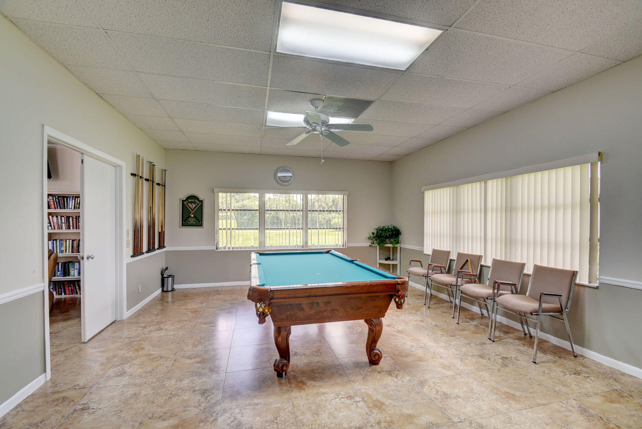 14110 Nesting Way, Unit A Delray Beach, FL 33484 - Photo 26 of 30 a room with furniture pool table and flat screen tv