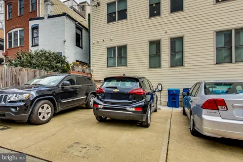 a front view of a house with parking space