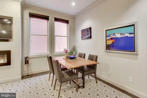 a view of a dining room with furniture and window