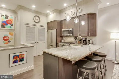 a kitchen with a table and chairs in it