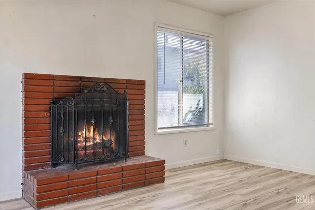 a view of fireplace and wooden floor