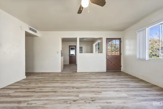 a view of an empty room with a window