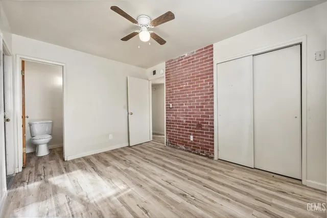 a view of empty room with a bathroom