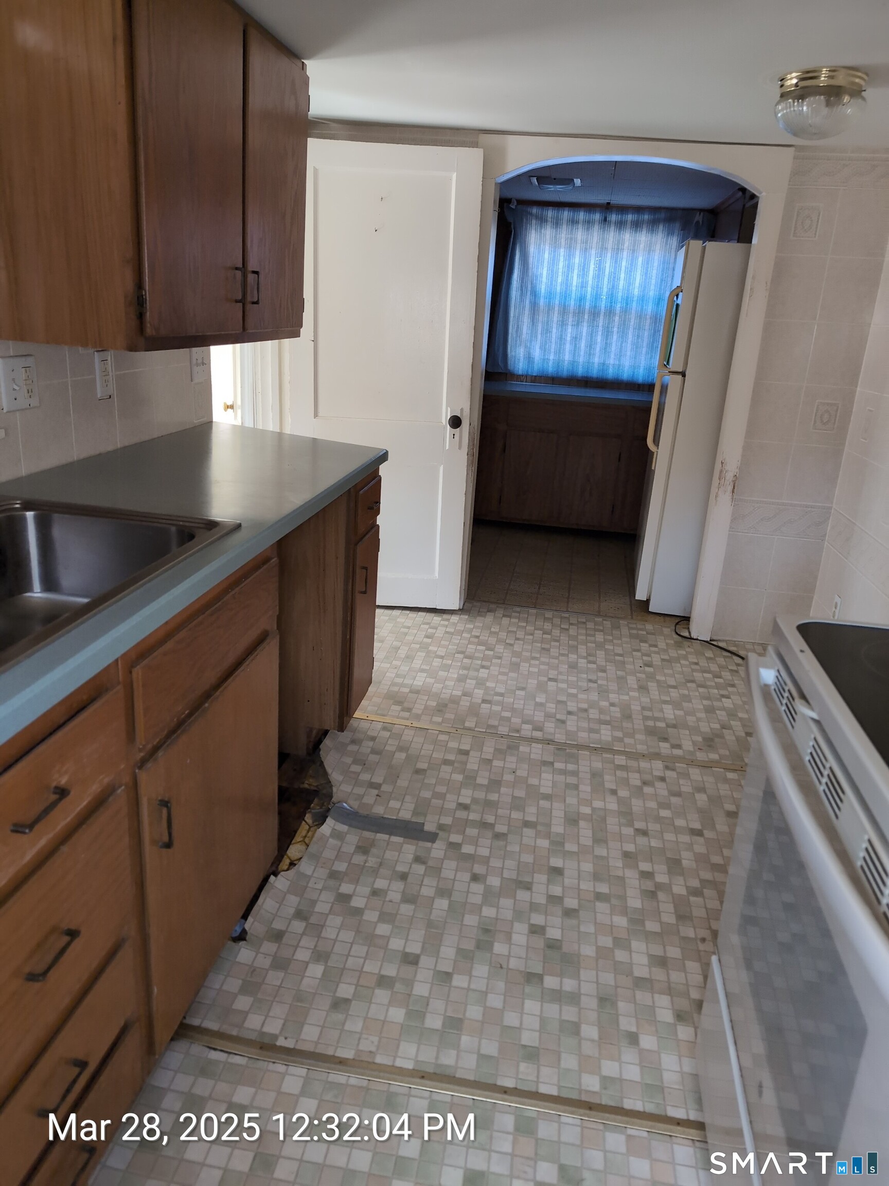 97 Bushy Hill Road Deep River, CT 06417 - Photo 14 of 28 a kitchen with a sink window and cabinets