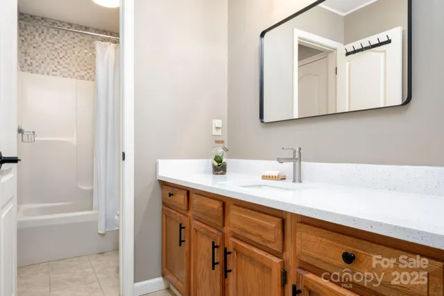 a bathroom with a sink a vanity and a mirror