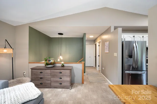 a room with a bed and a mirror