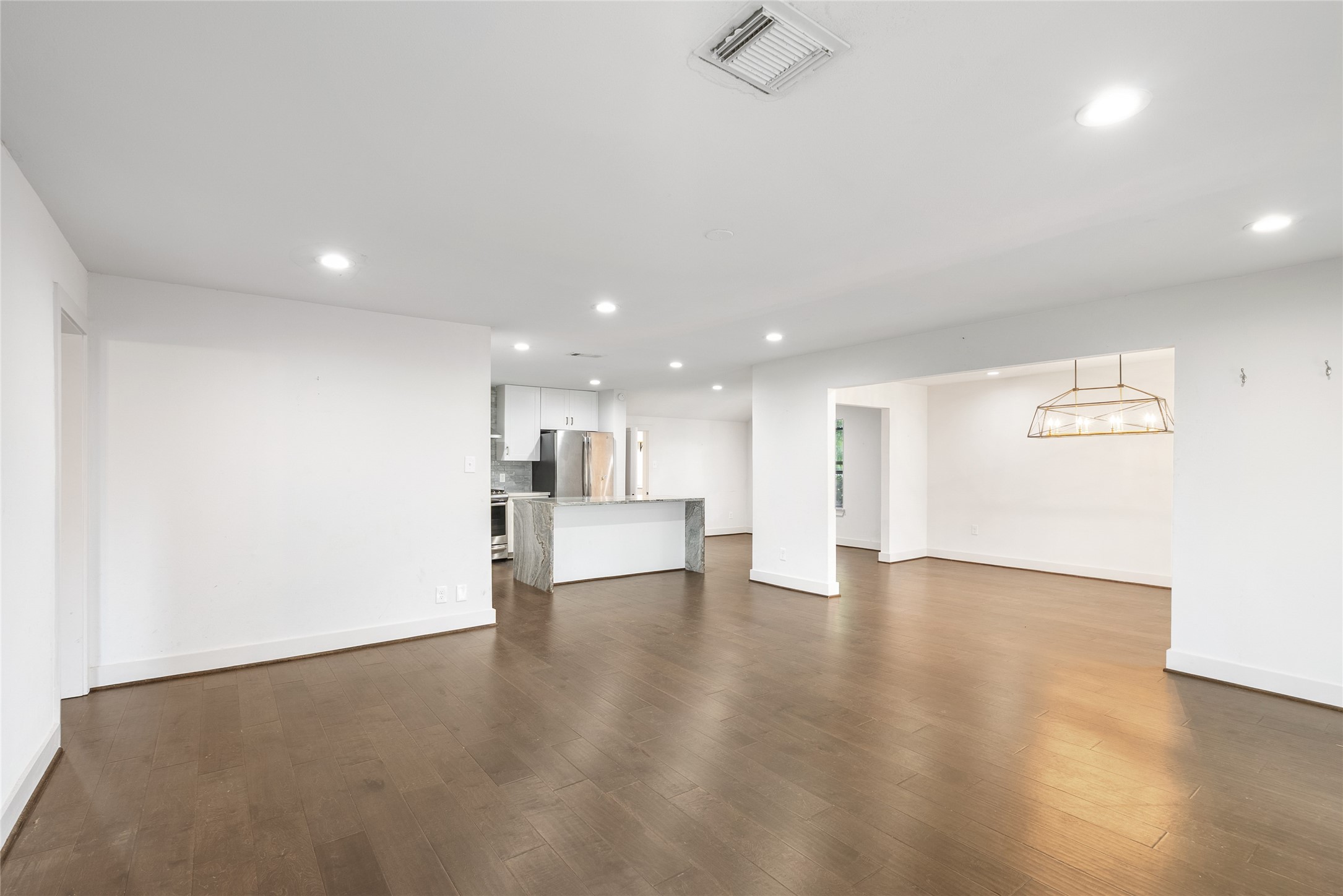 7307 Raton Street Houston, TX 77055 - Photo 7 of 23 This open space allows for many creative furniture arrangemets!