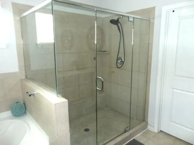 a bathroom with a shower and a toilet