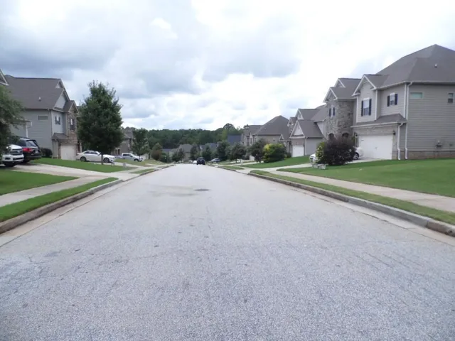 a view of a road with a building in the background