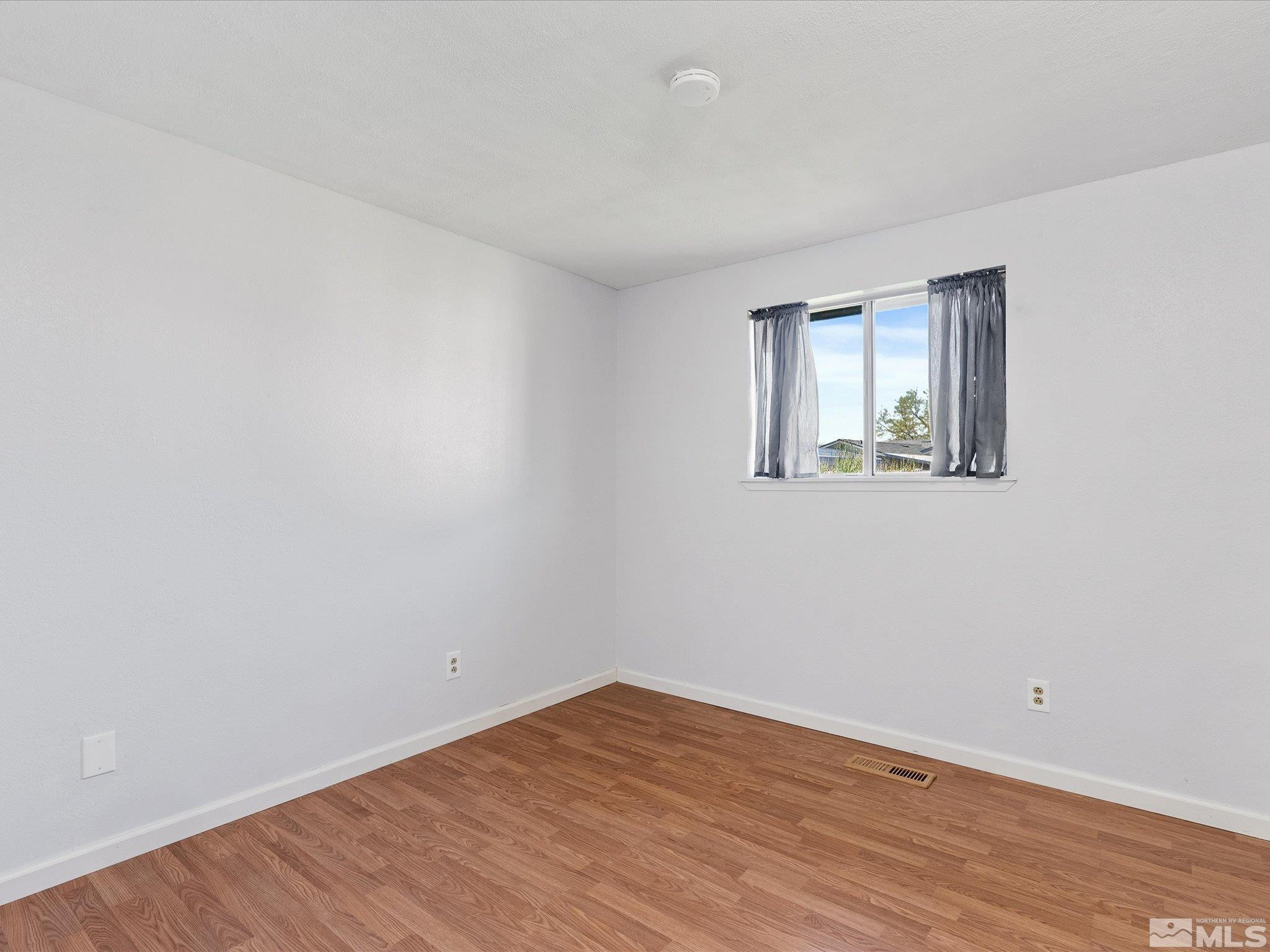 910 Concord Avenue Fallon, NV 89406 - Photo 23 of 40 wooden floor in an empty room