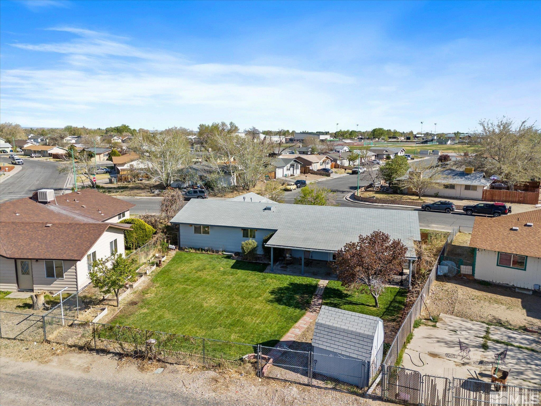 910 Concord Avenue Fallon, NV 89406 - Photo 38 of 40 an aerial view of a house with a garden and lake view