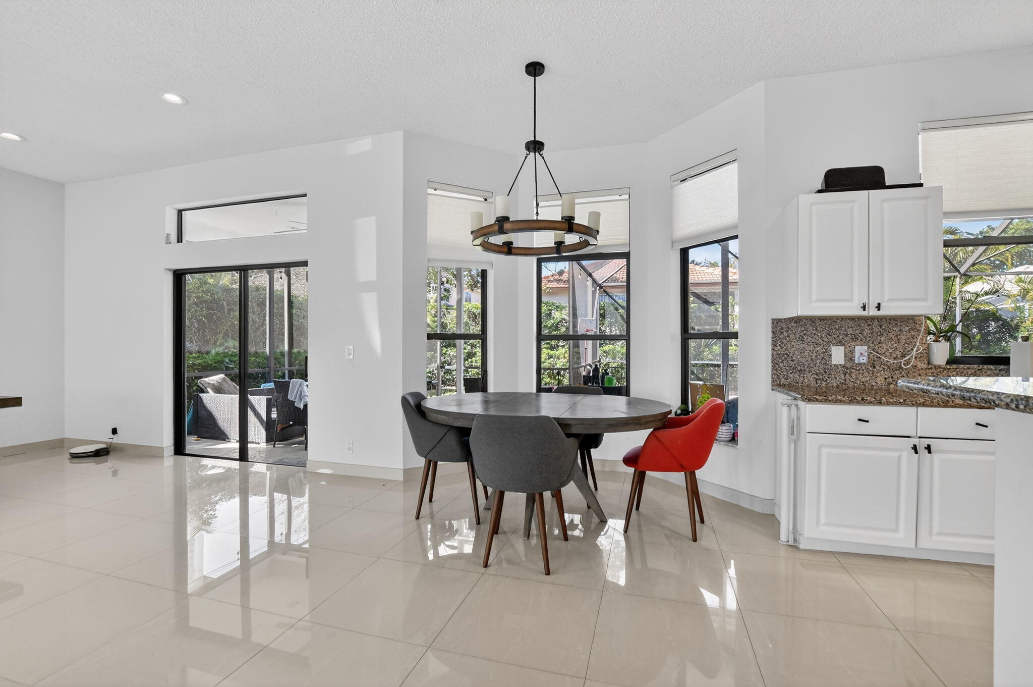 10058 Umberland Place Boca Raton, FL 33428 - Photo 15 of 55 a dining room with furniture and window