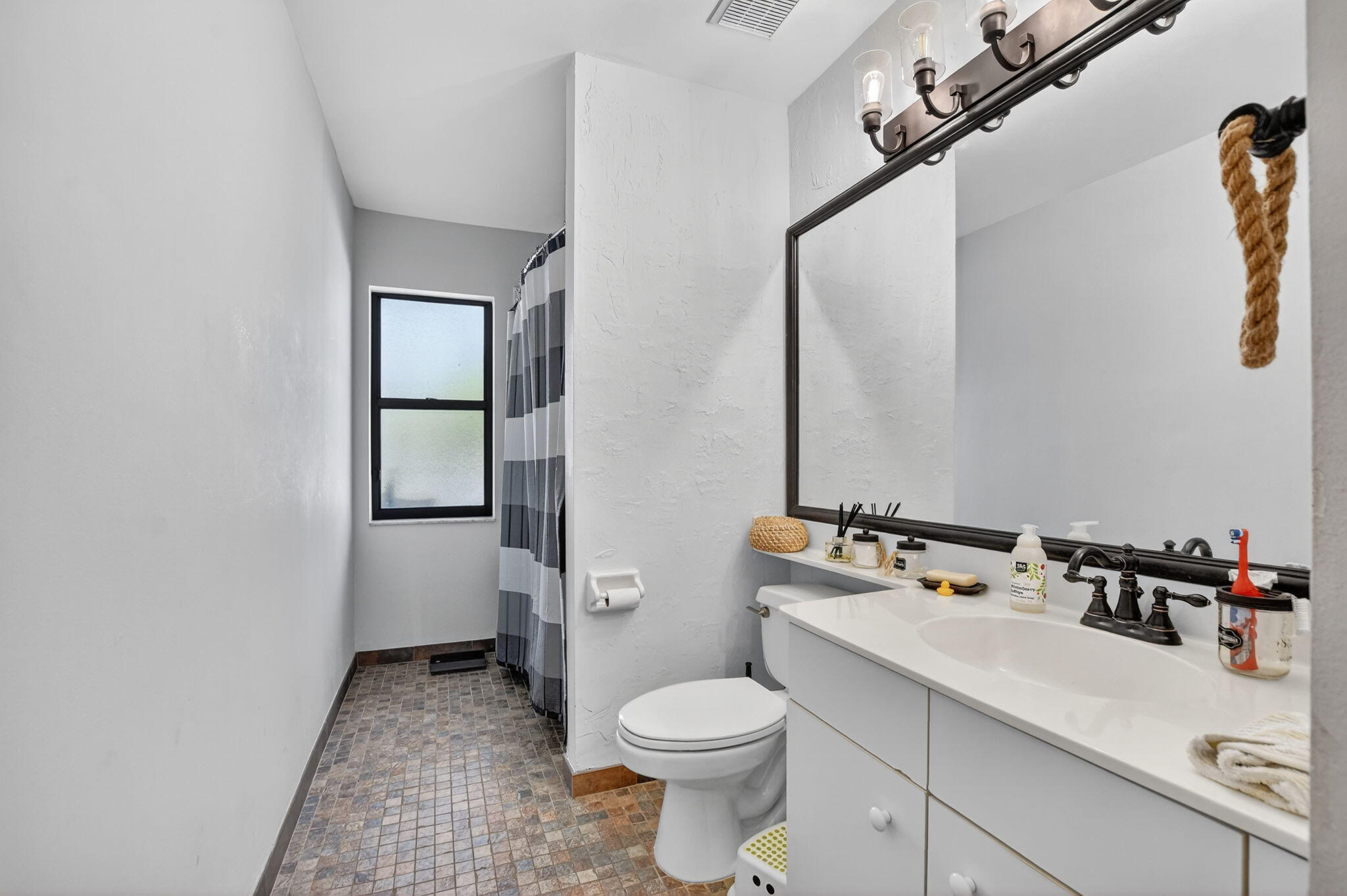 10058 Umberland Place Boca Raton, FL 33428 - Photo 23 of 55 a bathroom with a sink and a toilet