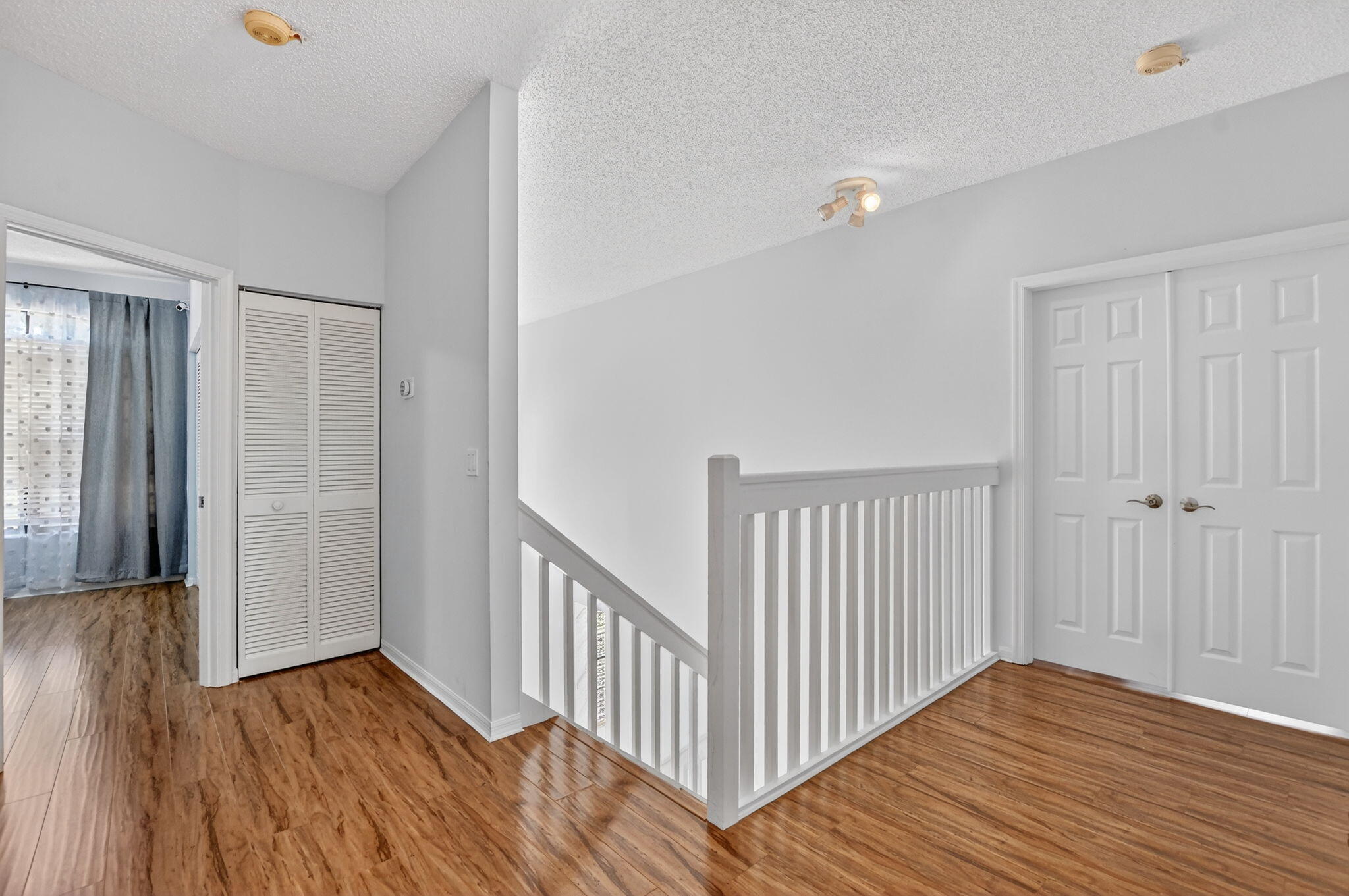 10058 Umberland Place Boca Raton, FL 33428 - Photo 28 of 55 a view of a room with wooden floor and staircase