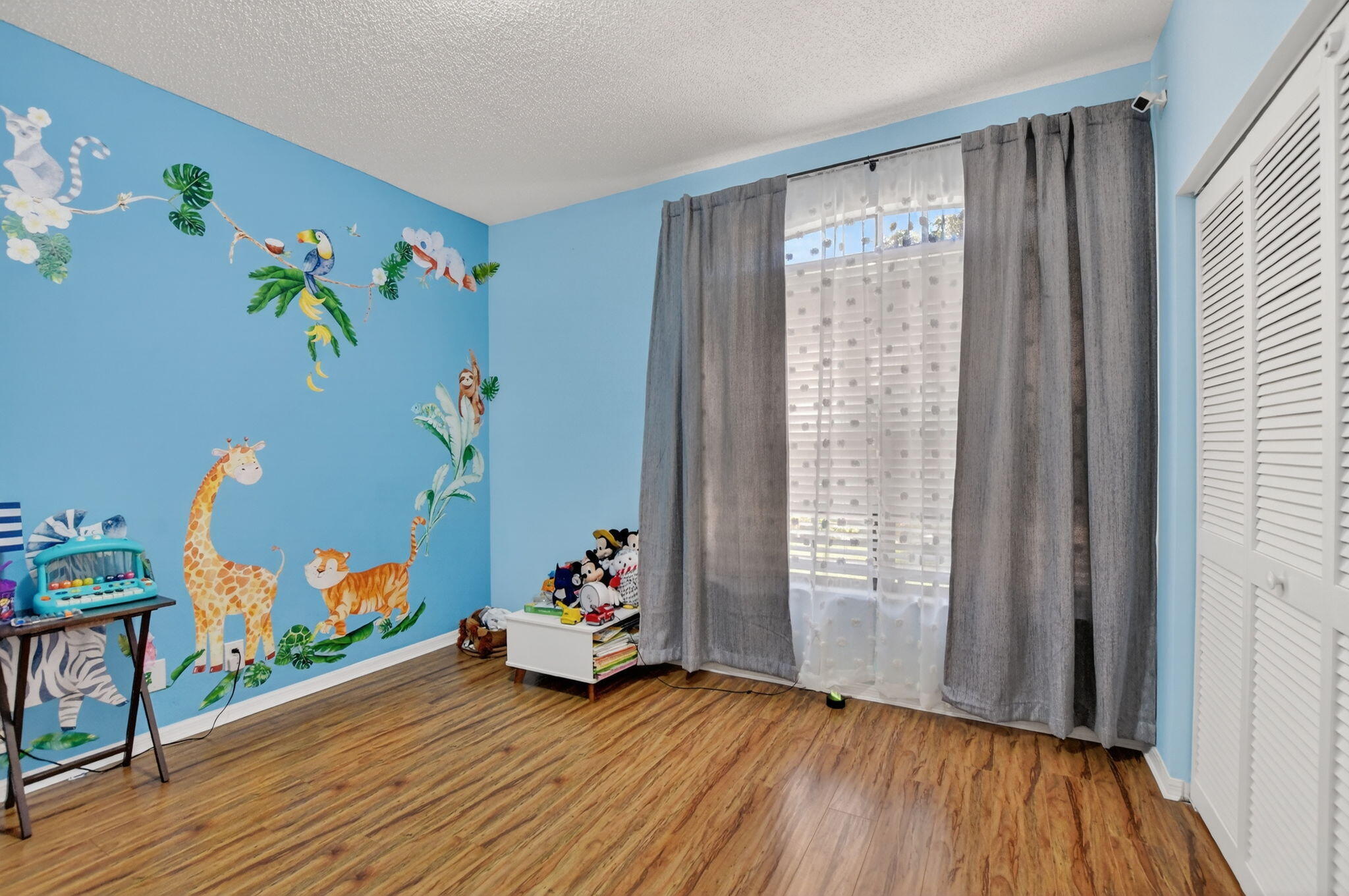 10058 Umberland Place Boca Raton, FL 33428 - Photo 29 of 55 a view of a room with toys and wooden floor