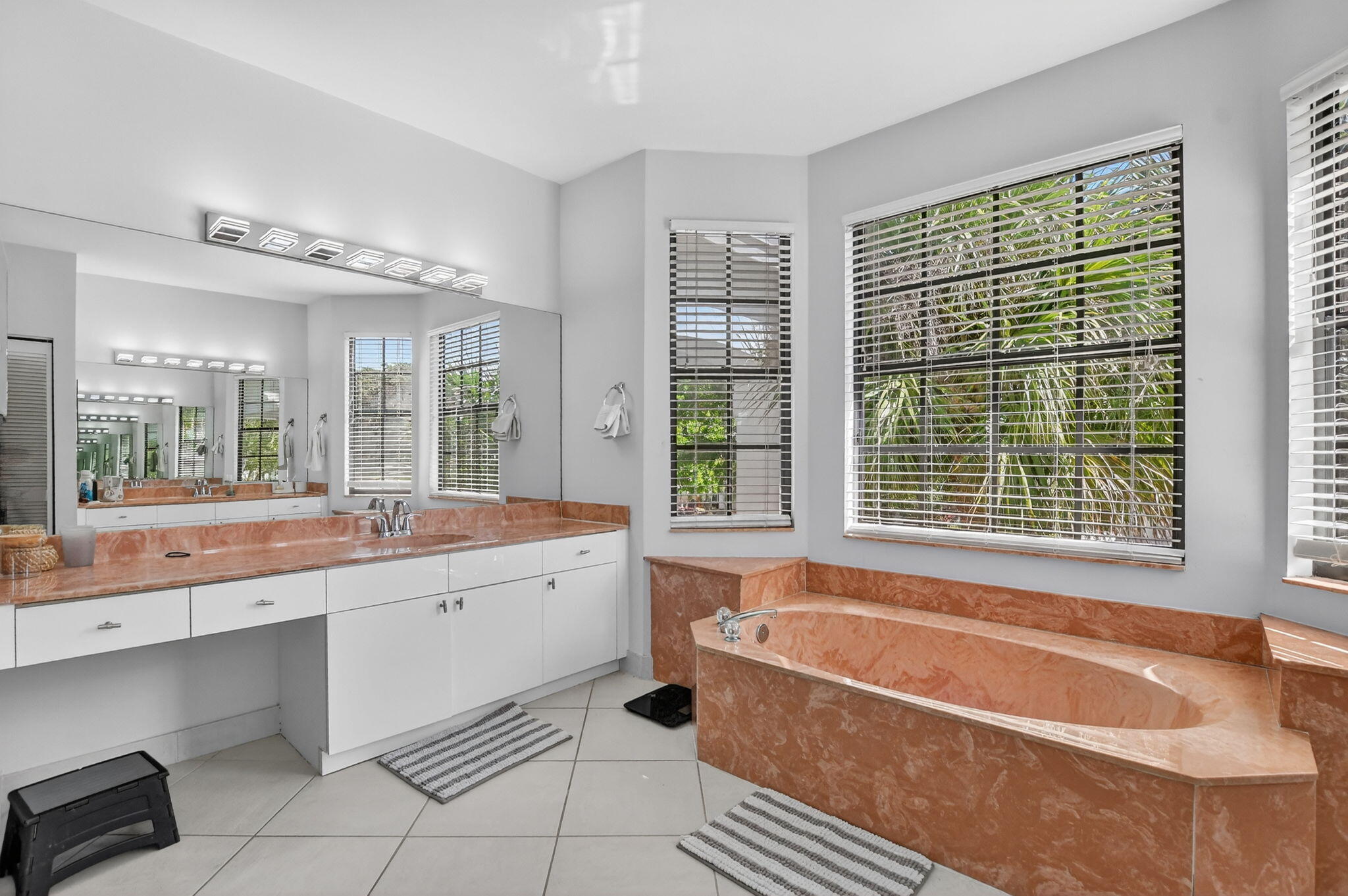10058 Umberland Place Boca Raton, FL 33428 - Photo 40 of 55 a bathroom with a granite countertop tub a sink and a large window