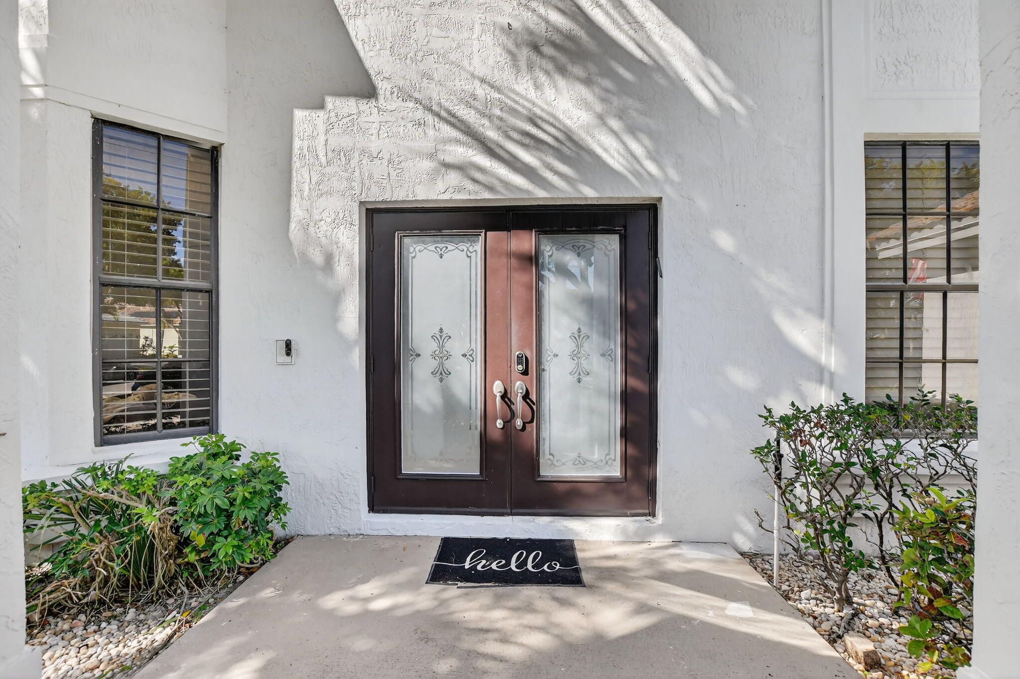 10058 Umberland Place Boca Raton, FL 33428 - Photo 4 of 55 a view of potted plant in front of a door