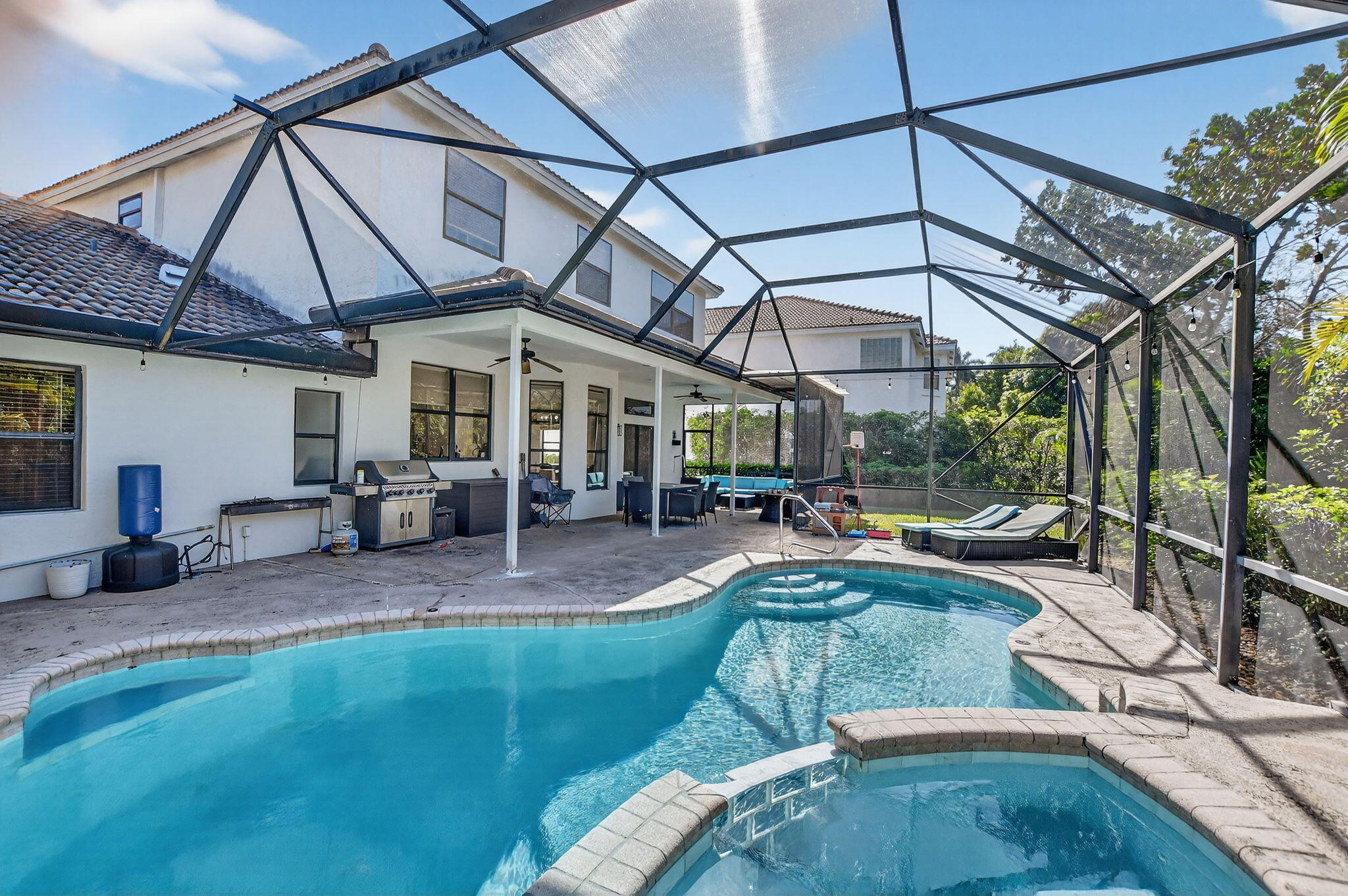 10058 Umberland Place Boca Raton, FL 33428 - Photo 41 of 55 a view of a swimming pool with a patio