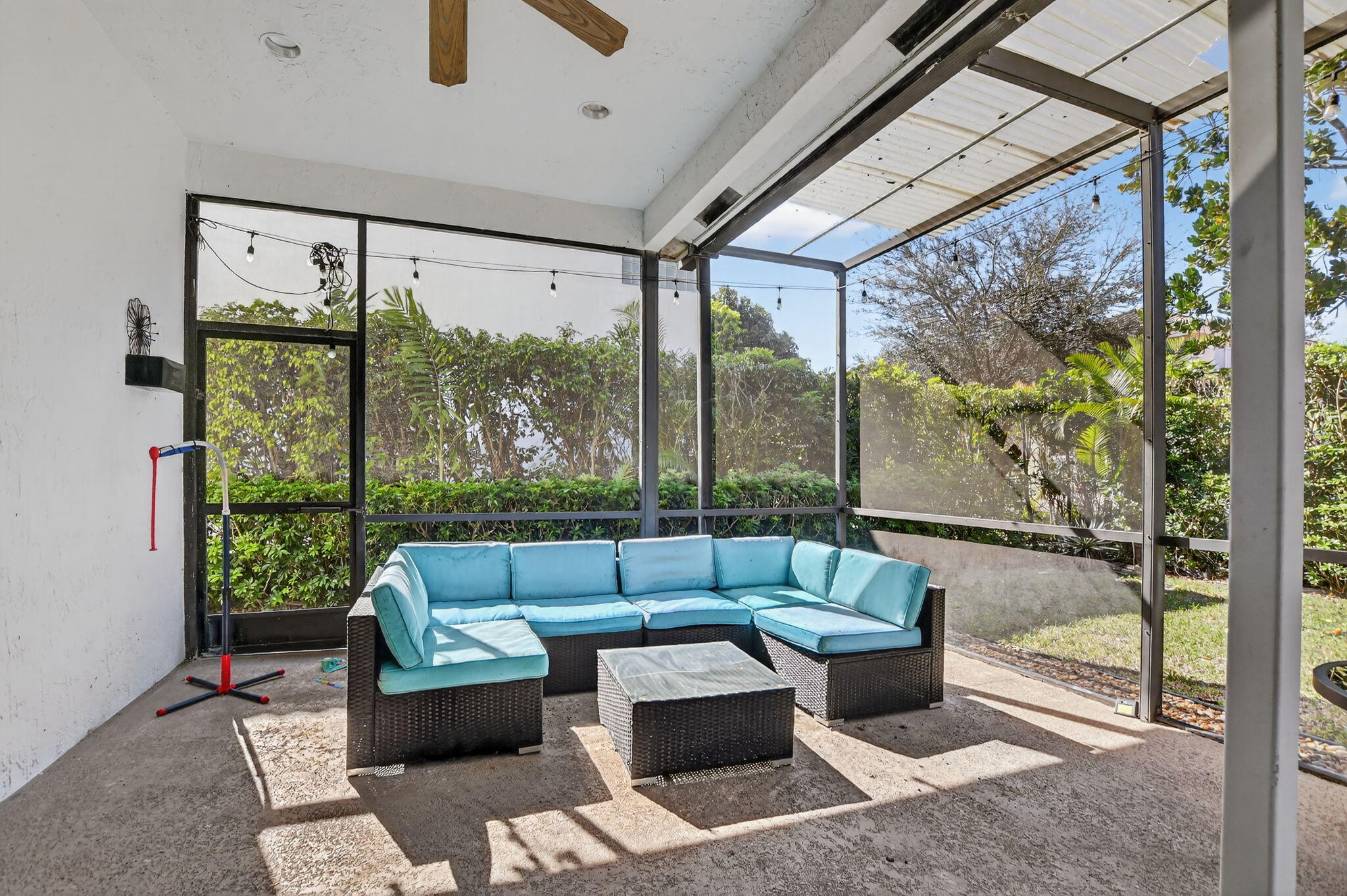 10058 Umberland Place Boca Raton, FL 33428 - Photo 43 of 55 a living room with furniture and a large window