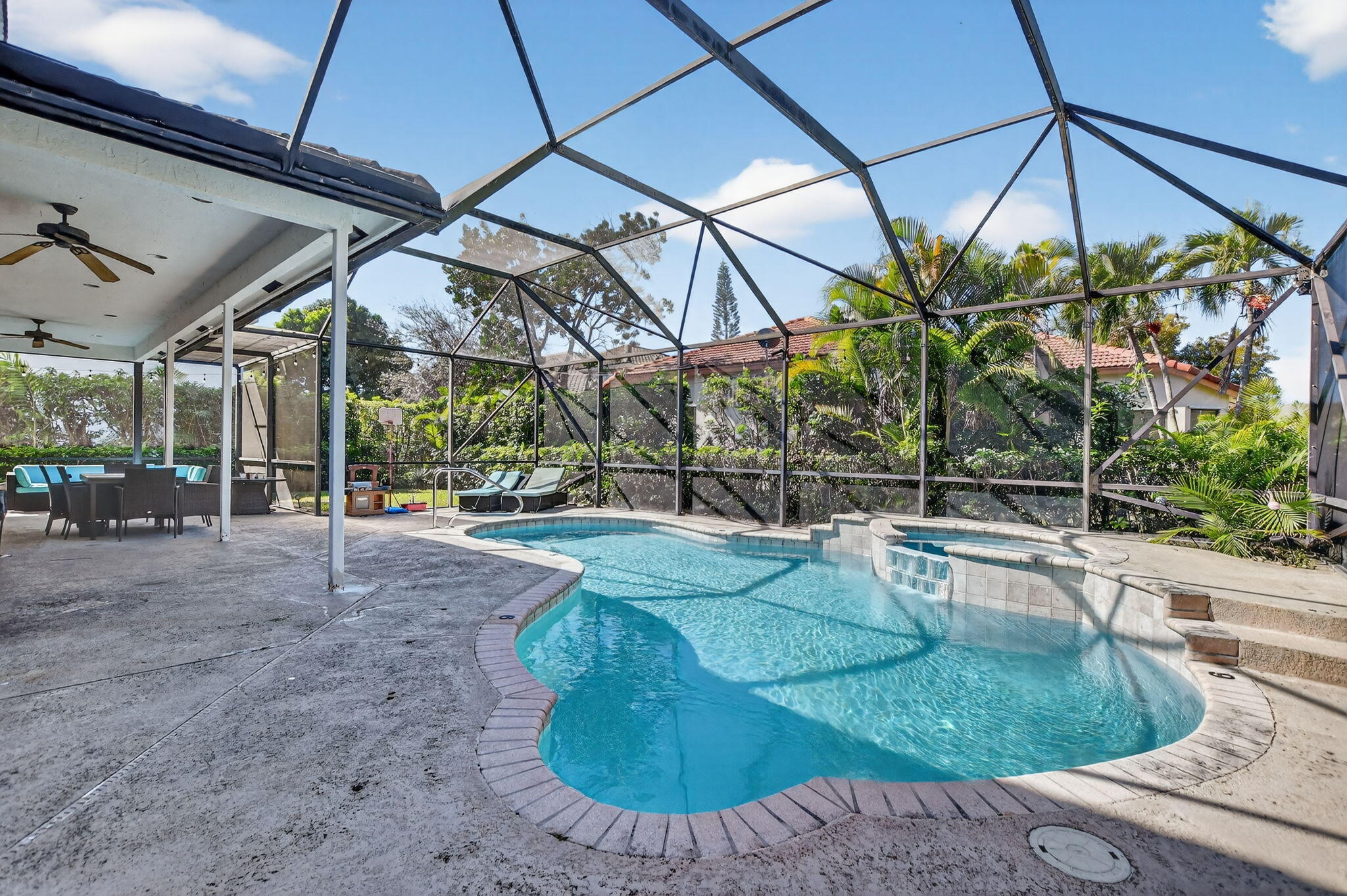 10058 Umberland Place Boca Raton, FL 33428 - Photo 45 of 55 a view of a swimming pool with a patio