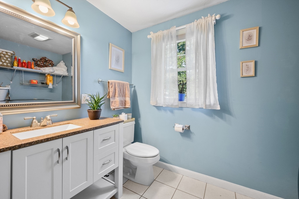 16 Balfour Lane Mashpee, MA 02649 - Photo 14 of 32 a bathroom with a toilet sink and mirror
