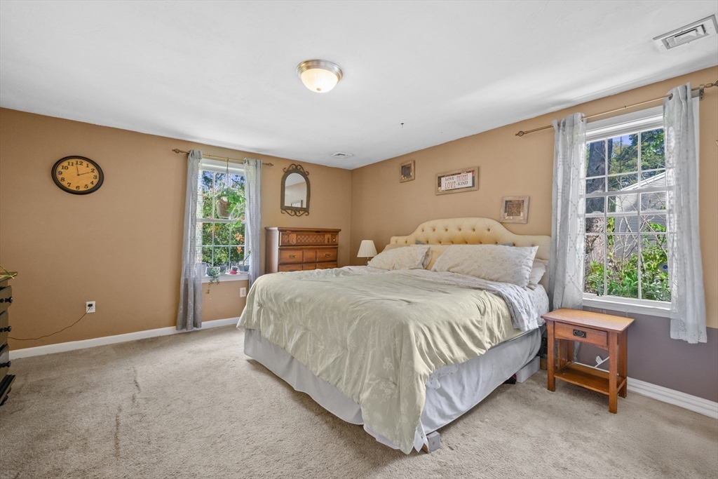 16 Balfour Lane Mashpee, MA 02649 - Photo 22 of 32 a bedroom with a bed and a window