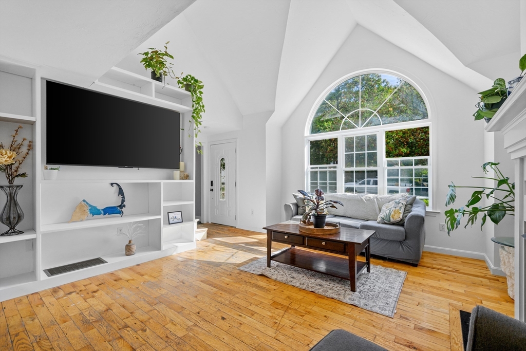 16 Balfour Lane Mashpee, MA 02649 - Photo 5 of 32 a living room with furniture and a flat screen tv