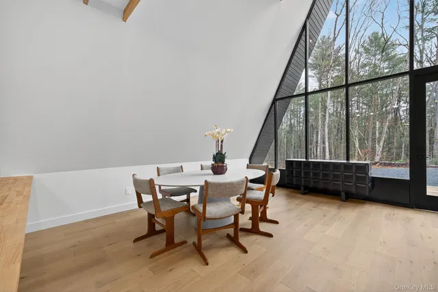 a view of a room with furniture and a window