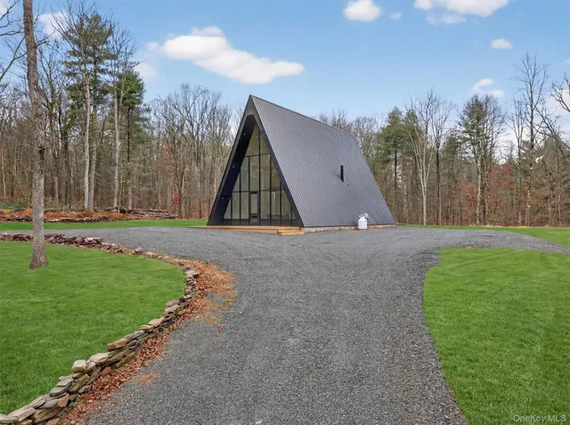 a view of outdoor space with green field and trees