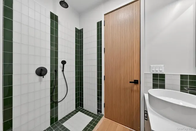 a bathroom with a shower and a sink
