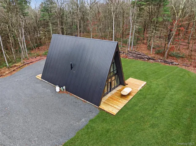 a view of backyard with a small cabin