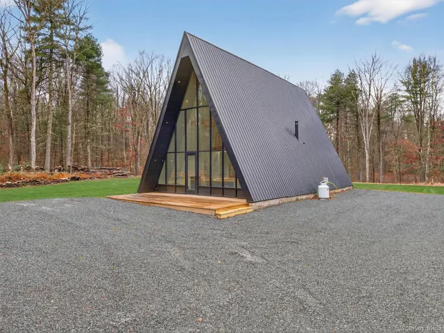 a view of a house with a park and entertaining space