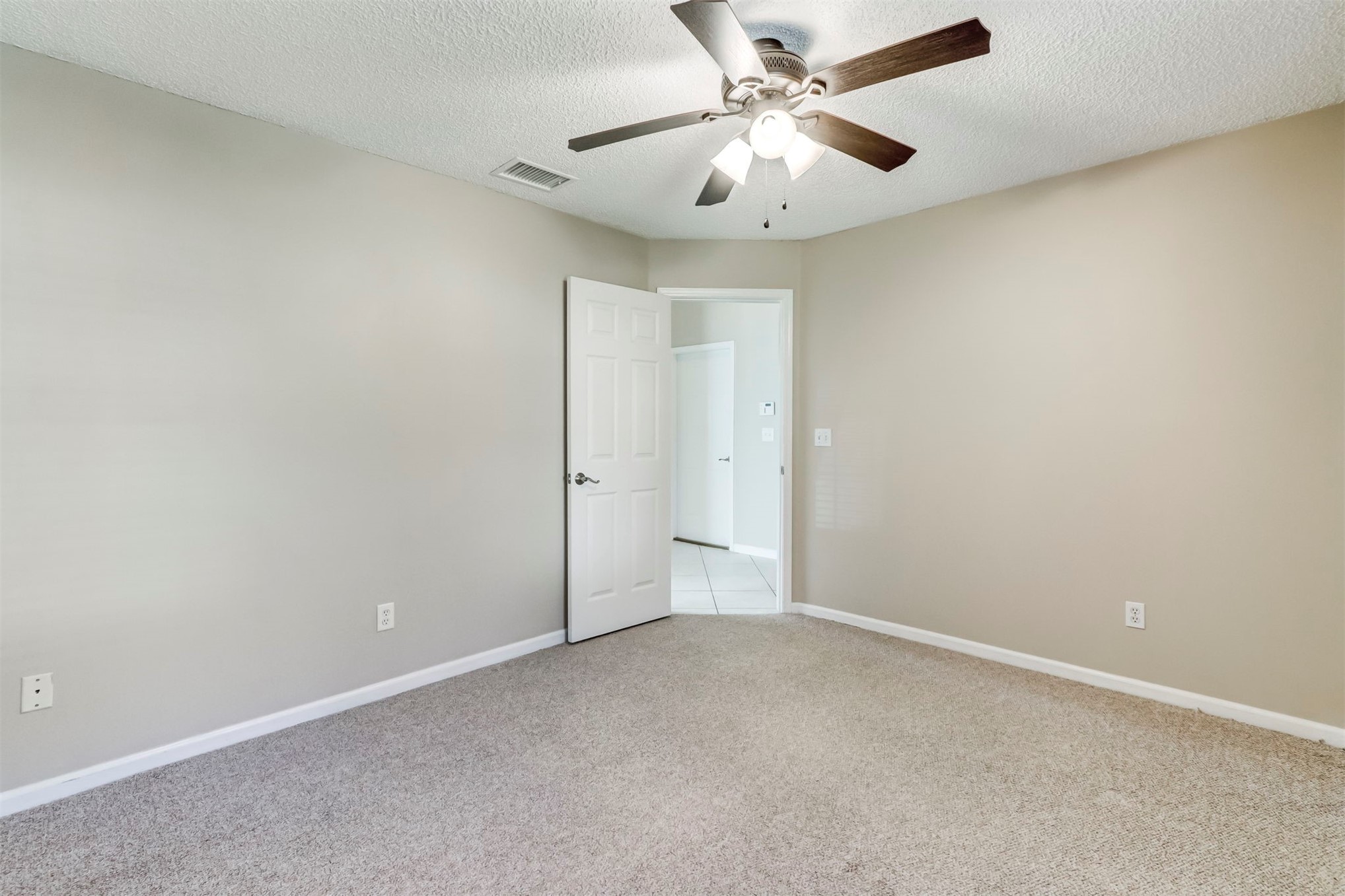 2415 Will Hardee Road Fernandina Beach, FL 32034 - Photo 36 of 59 an empty room with a fan and a fan