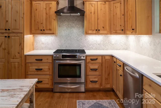 a kitchen with a stove and a sink