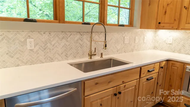 a view with a sink and dishwasher