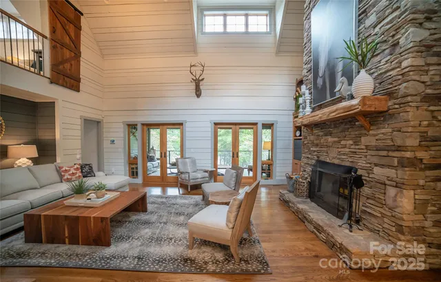 a living room with furniture wooden floor and a fireplace