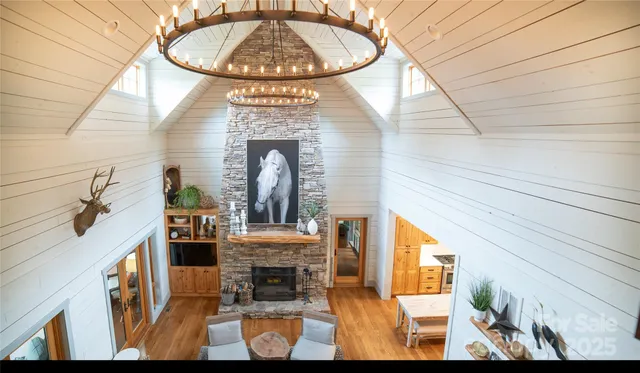 a view of living room with furniture and fireplace