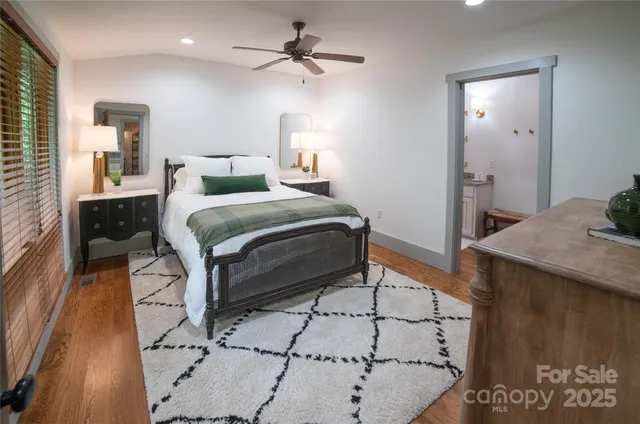 a bedroom with a bed and a table in it