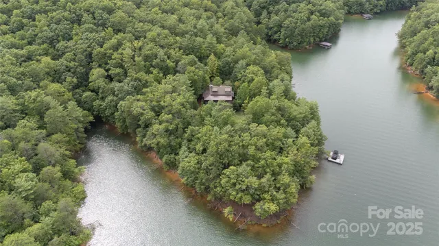 an aerial view of a house with a yard and garden