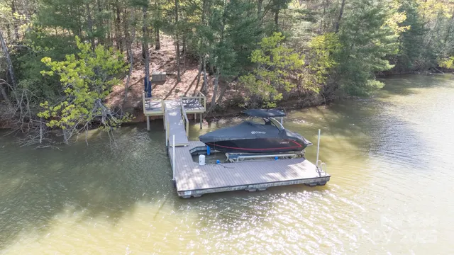 a view of a lake with a barn