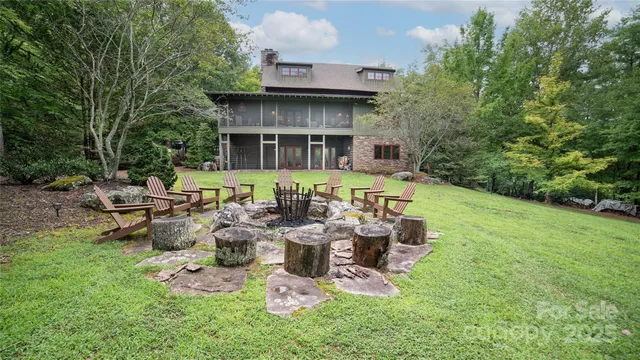 a view of a house with backyard sitting area and garden